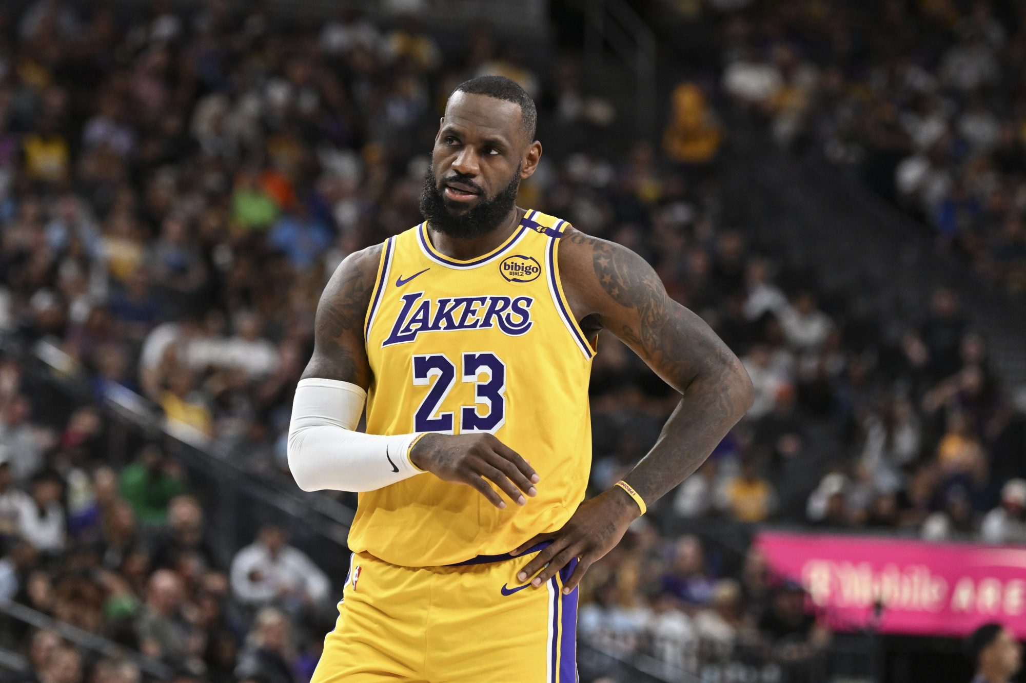 Los Angeles Lakers forward LeBron James (23) looks on against the Golden State Warriors in the first quarter during a preseason game at T-Mobile Arena.