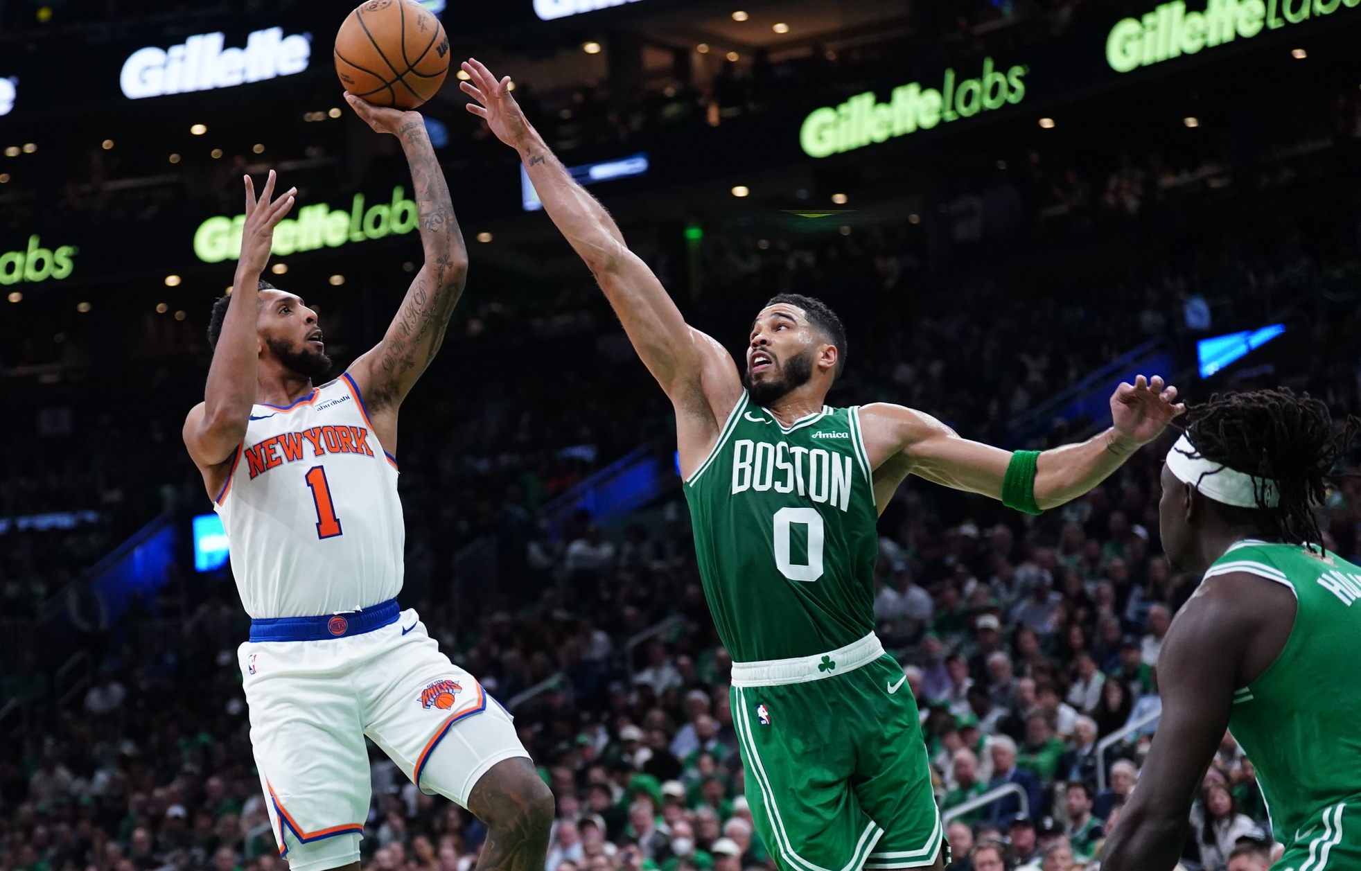 Oct 22, 2024; Boston, Massachusetts, USA; New York Knicks guard Cameron Payne (1) shoots against Boston Celtics forward Jayson Tatum (0)in the second half at TD Garden.