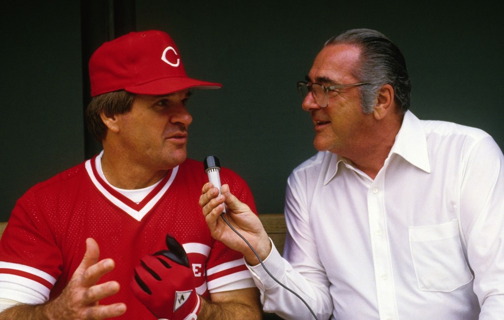 Pete Rose talks to a reporter