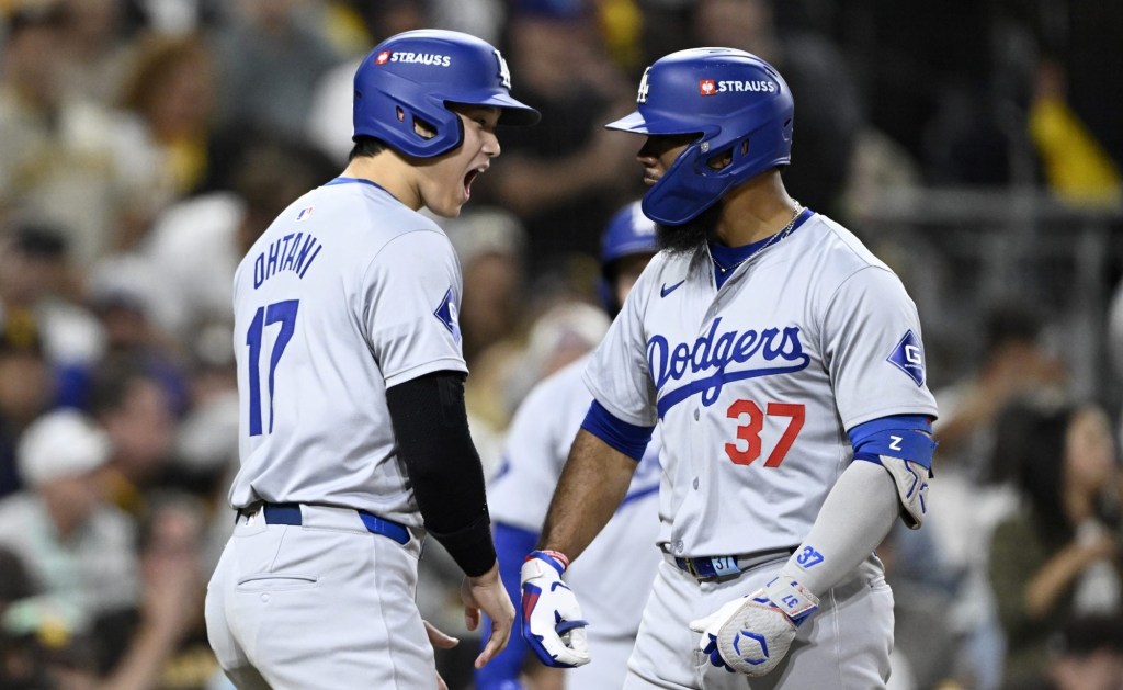 Oct 8, 2024; San Diego, California, USA; Los Angeles Dodgers outfielder Teoscar Hernandez (37) celebrates with designated hitter Shohei Ohtani (17) after hitting a grand slam in the third inning against the San Diego Padres during game three of the NLDS for the 2024 MLB Playoffs at Petco Park.