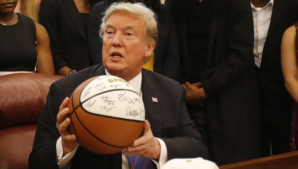 Donald Trump holding a basketball in the White House