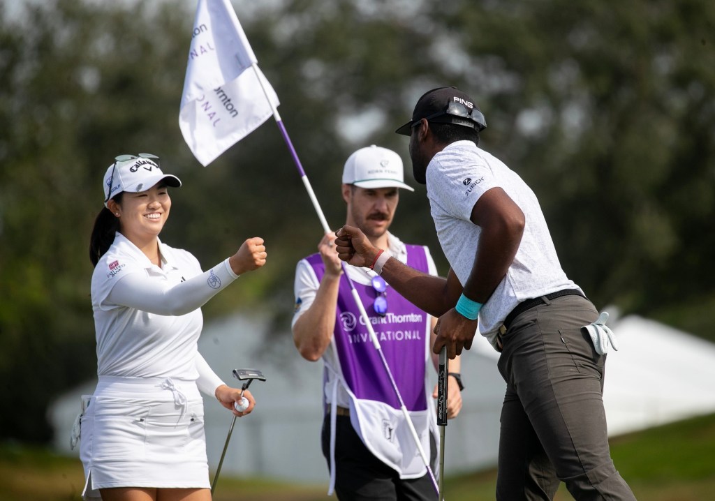 Rose Zhang congratulates her teammate Sahith Theegala after making his putt on the 9th green at the Grant Thornton Invitational at Tiburon Golf Club in Naples on Friday, Dec. 8, 2023.