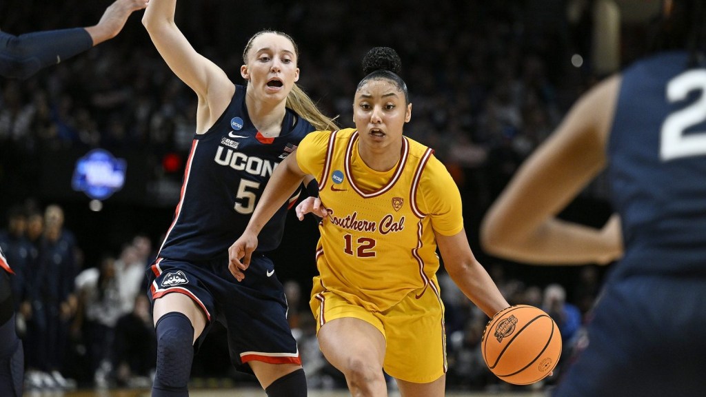 Apr 1, 2024; Portland, OR, USA; USC Trojans guard JuJu Watkins (12) drives to the basket during the second half against UConn Huskies guard Paige Bueckers (5) in the finals of the Portland Regional of the NCAA Tournament at the Moda Center.