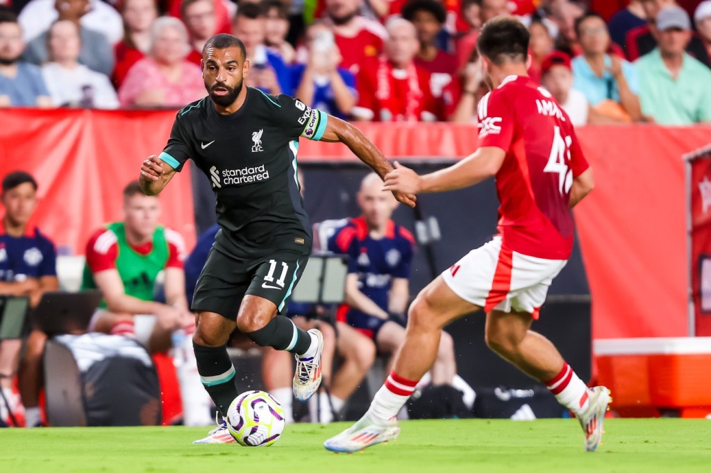 Aug 3, 2024; Columbia, South Carolina, USA; Liverpool forward Mohamed Salah (11) drives past Manchester United Harry Amass (41) at Williams-Brice Stadium.