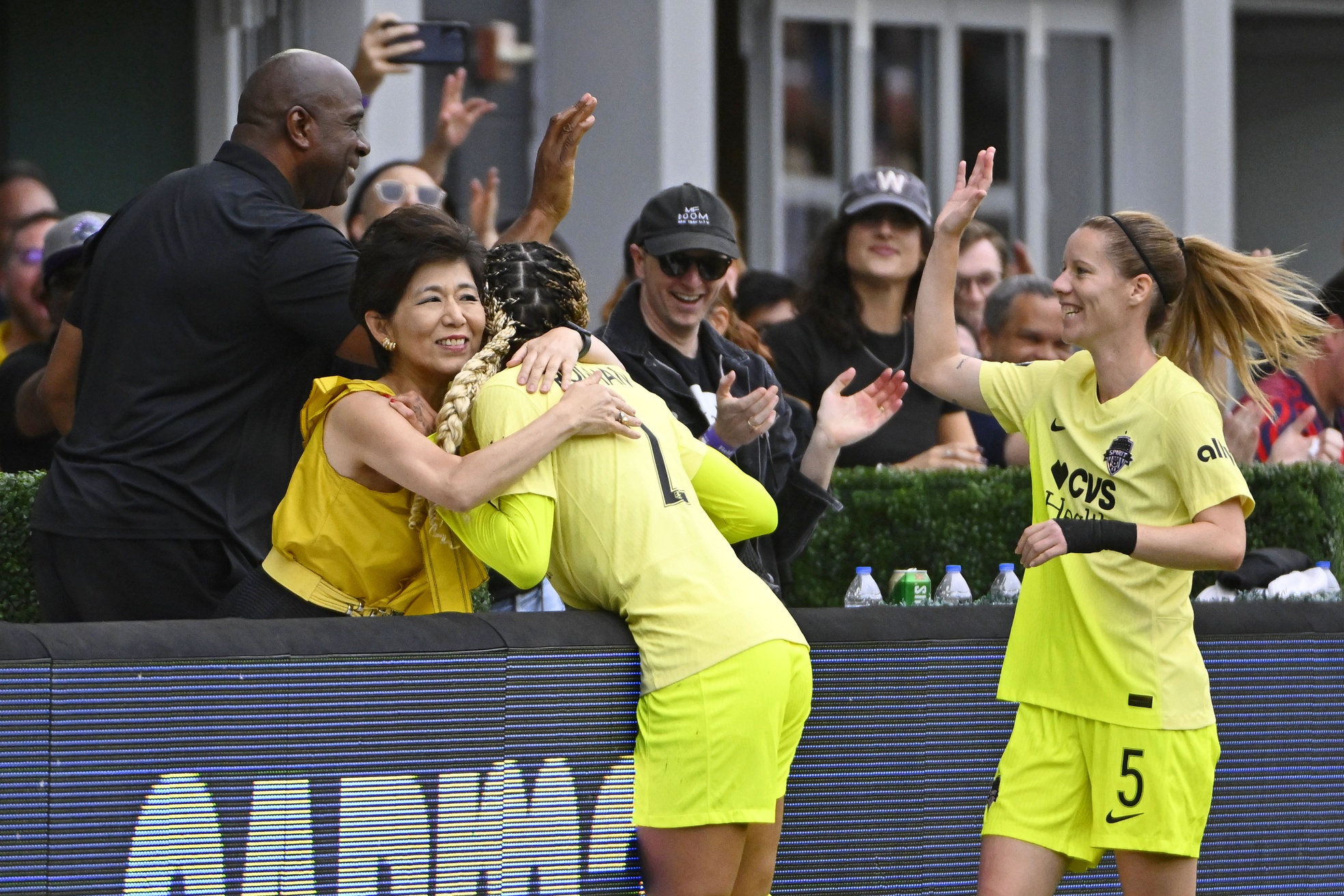 Sep 7, 2024; Washington, District of Columbia, USA; Washington Spirit forward Trinity Rodman (2) celebrates with owner Michel Kang and Washington Commanders owner Magic Johnson after scoring a goal against Portland Thorns FC during the second half at Audi Field