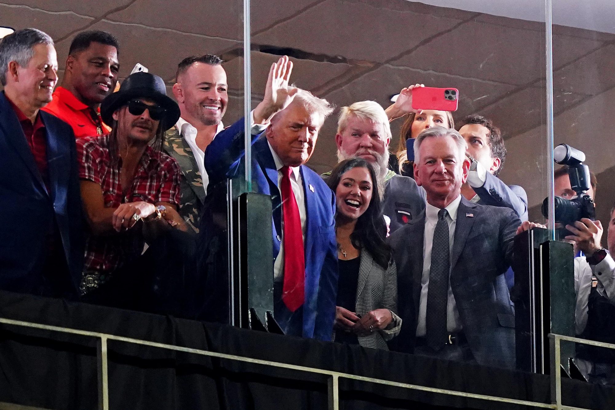 Sep 28, 2024; Tuscaloosa, Alabama, USA; GOP Presidential candidate Donald Trump waves flanked by former Georgia Bulldogs player Herschel Walker, recording art Kid Rock, professional golfer John Daily, Alabama senators Tommy Tuberville (R) and Katie Britt (R) during the second half of the game between the Alabama Crimson Tide and the Georgia Bulldogs at Bryant-Denny Stadium.