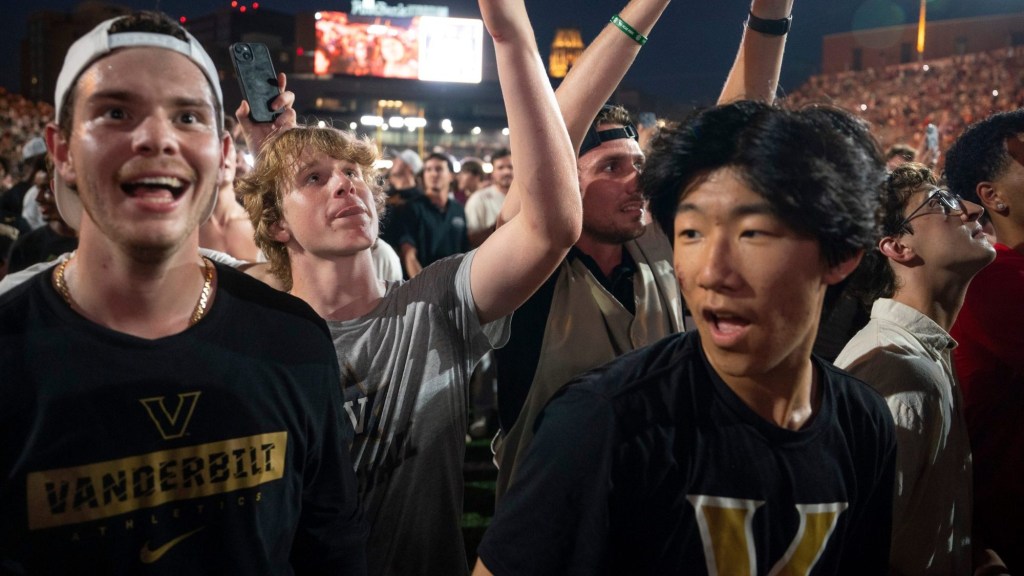 Vanderbilt Commodores fans head to the south end zone as the goal post is taken down by exuberant fans after beating No. 1 Alabama 40-35 at Vanderbilt Stadium in Nashville, Tenn., Saturday, Oct. 5, 2024.