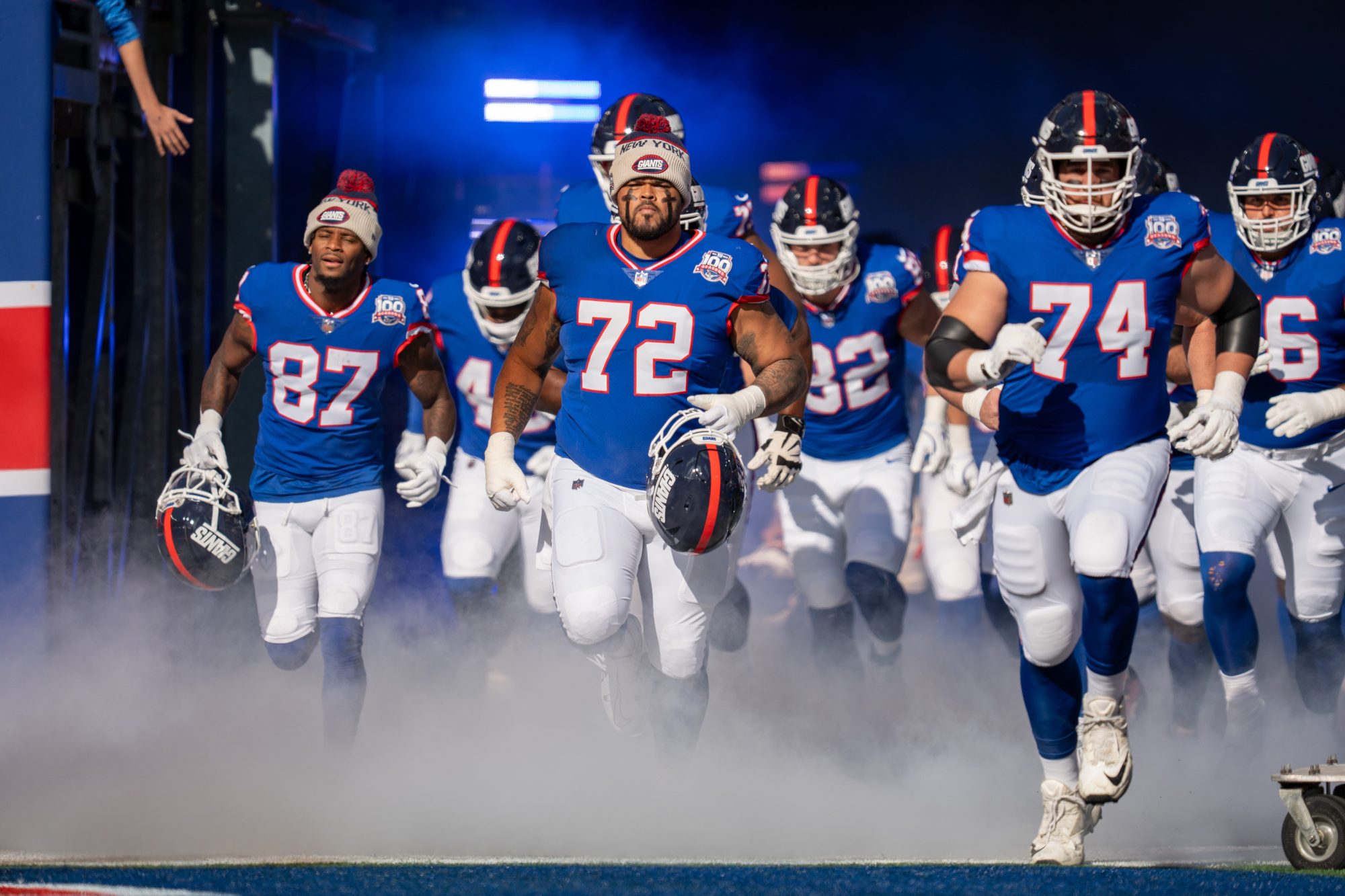 Members of the NY Giants run onto the field to start the game between the New York Giants and the Washington Commanders at MetLife Stadium in East Rutherford on Sunday, Nov. 3, 2024.