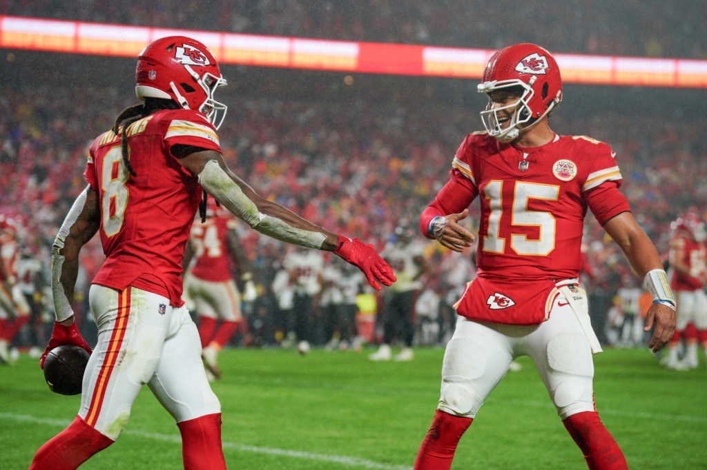 Nov 4, 2024; Kansas City, Missouri, USA; Kansas City Chiefs wide receiver DeAndre Hopkins (8) celebrates with quarterback Patrick Mahomes (15) after scoring against the Tampa Bay Buccaneers during the second half at GEHA Field at Arrowhead Stadium.