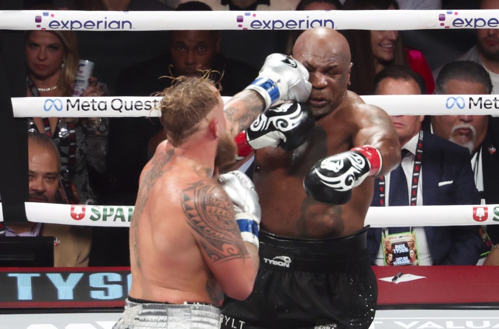 Nov 15, 2024; Arlington, Texas, UNITED STATES; Mike Tyson (black gloves) fights Jake Paul (silver gloves) at AT&T Stadium.