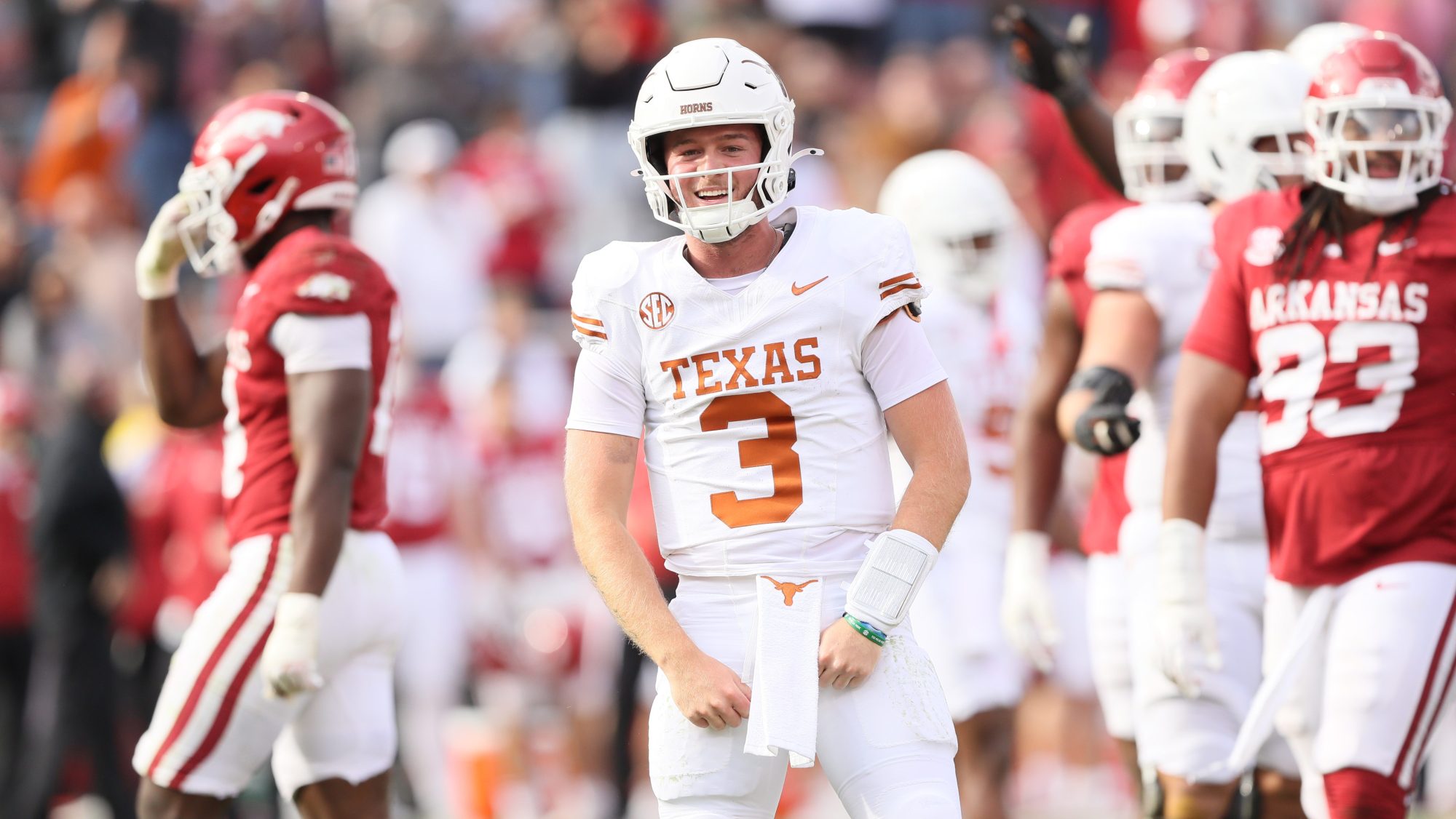 Nov 16, 2024; Fayetteville, Arkansas, USA; Texas Longhorns quarterback Quinn Ewers (3) celebrates after making a final first down to end the game against the Arkansas Razorbacks at Donald W. Reynolds Razorback Stadium. Texas won 20-10.