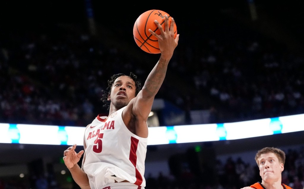 Nov 20, 2024; Birmingham, AL, USA; Alabama forward Derrion Reid (35) grabs a rebound in the CM Newton Classic at Legacy Arena. Alabama defeated Illinois 100-87.