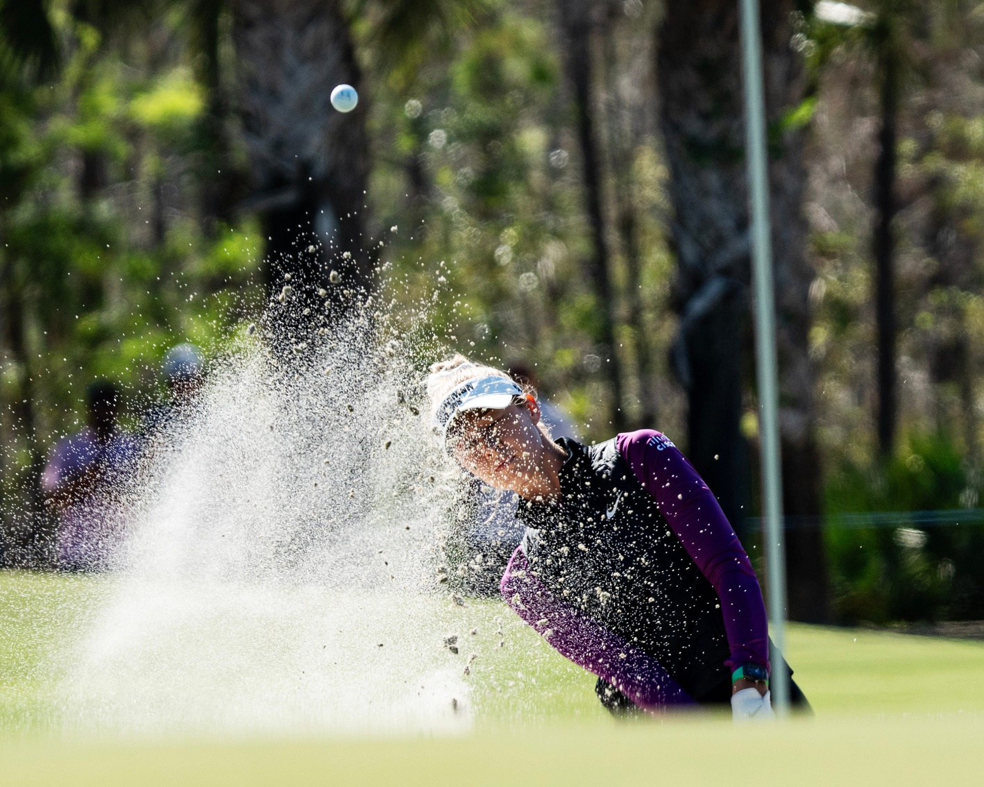 Nelly Korda hits out of a sand trap on the first hole of the first round of the 2024 CME Group Tour Championship at the Tiburon Golf Club at the Ritz Carlton in Naples on Thursday, Nov. 21, 2024.