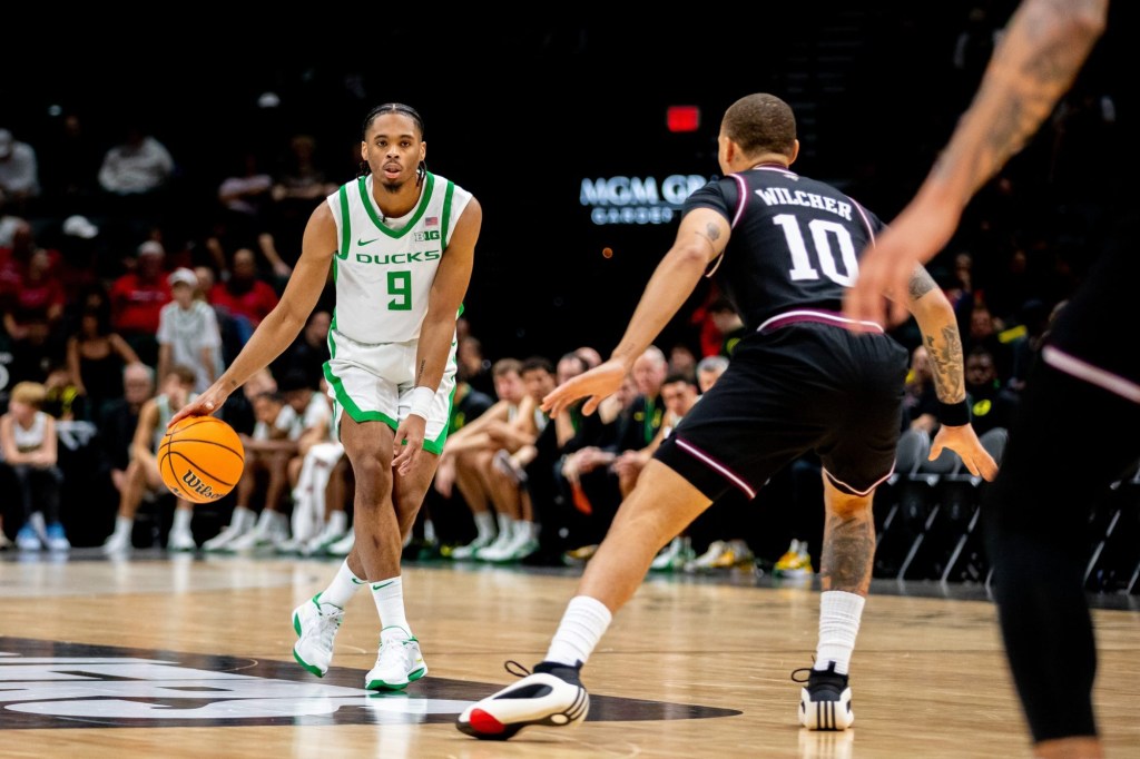 Nov 26, 2024; Las Vegas, Nevada, USA; Oregon Ducks guard Keeshawn Barthelemy (9) approaches Texas A&M Aggies guard CJ Wilcher (10) during the first half at MGM Grand Garden Arena. Mandatory