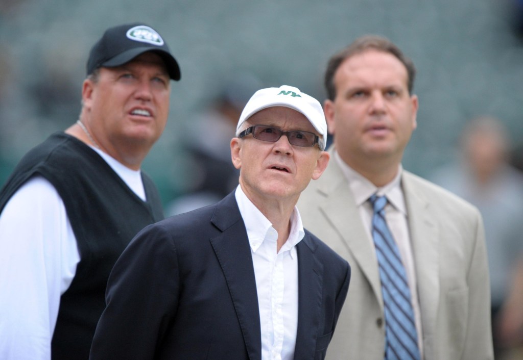 Sep 25, 2011; Oakland, CA, USA; New York Jets owner Woody Johnson (center), coach Rex Ryan (left) and general manager Mike Tannenbaum on the sidelines before the game against the Oakland Raiders at O.co Coliseum.