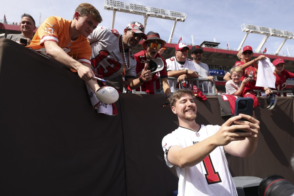 Oct 22, 2023; Tampa, Florida, USA; YouTuber Jimmy Donaldson MrBeast takes photos with fans before a game between the Atlanta Falcons and Tampa Bay Buccaneers at Raymond James Stadium.