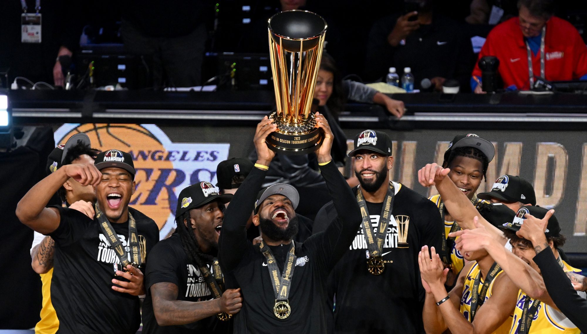 Dec 9, 2023; Las Vegas, Nevada, USA; Los Angeles Lakers forward LeBron James (23) hoists the NBA Cup and celebrates with teammates after winning the NBA In-Season Tournament Championship game against the Indiana Pacers at T-Mobile Arena.