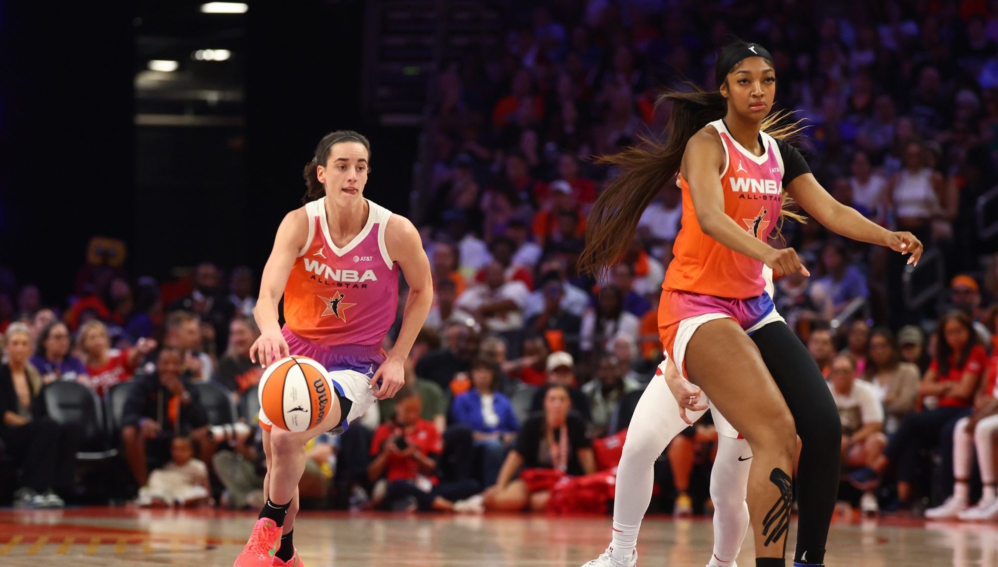 Jul 20, 2024; Phoenix, AZ, USA; Team WNBA guard Caitlin Clark (left) and Angel Reese against the USA Women's National Team during the 2024 WNBA All Star Game at Footprint Center.