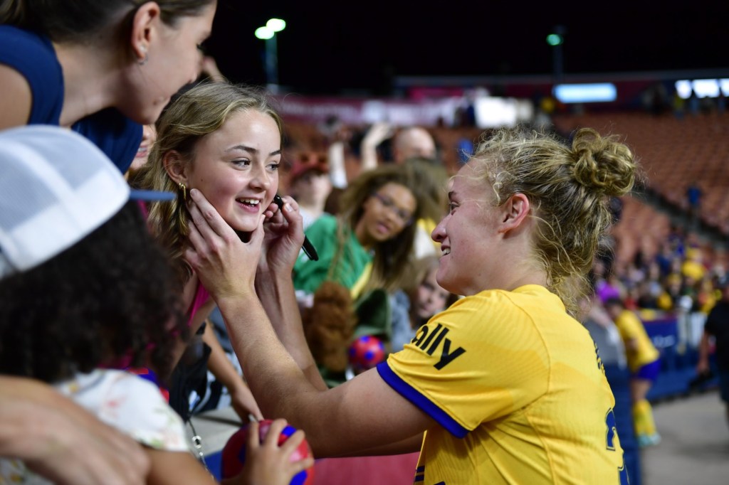 Aug 23, 2024; Sandy, Utah, USA; Utah Royals FC forward Hannah Betfort (33) signs autographs after the match against Bay FC at America First Field.