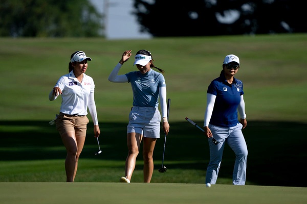 From left, Jeeno Thitikul, of Thailand, Lydia Ko, of New Zealand, and Yan Liu, of the Republic of China, walk onto the first green during the Kroger Queen City Classic in Cincinnati on Sunday, Sept. 22, 2024.