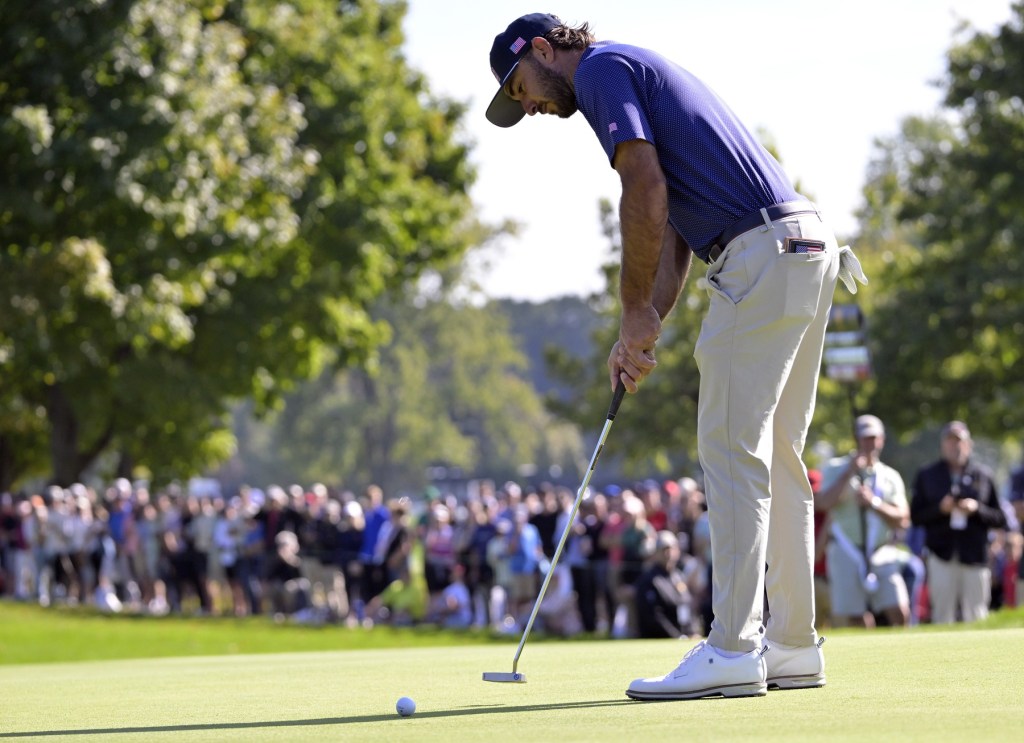 Sep 28, 2024; Ile Bizard, Quebec, CAN; Max Homa of team U.S.A. putts on the first green during the foursomes (alternate) round of The Presidents Cup golf tournament.