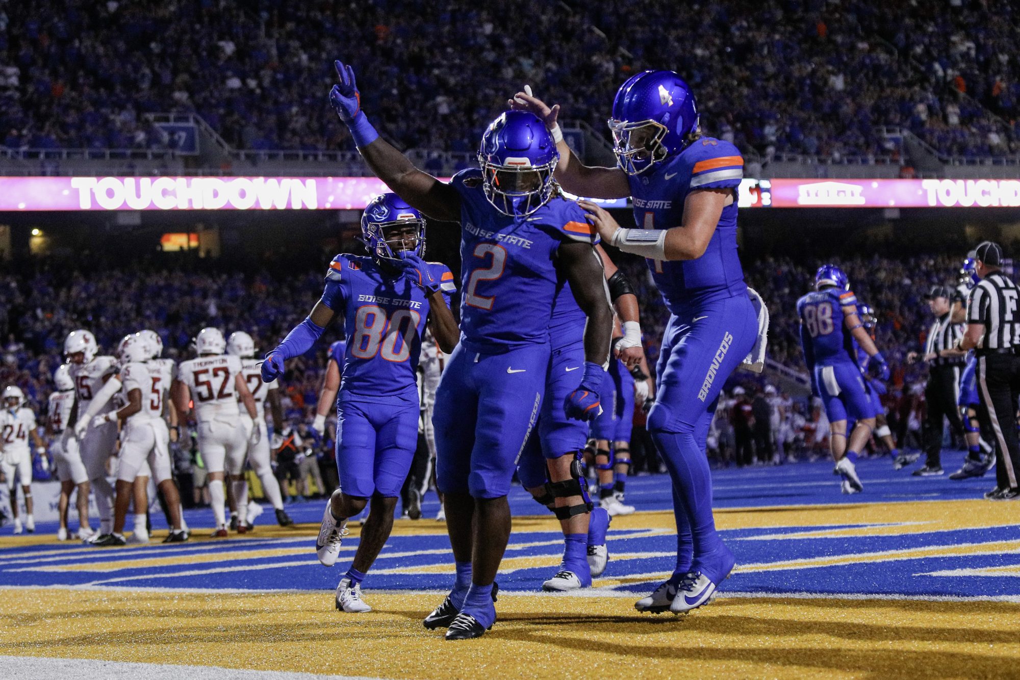 Sep 28, 2024; Boise, Idaho, USA; Boise State Broncos running back Ashton Jeanty (2) and quarterback Maddux Madsen (4) celebrate during the second quarter against the Washington State Cougars at Albertsons Stadium.