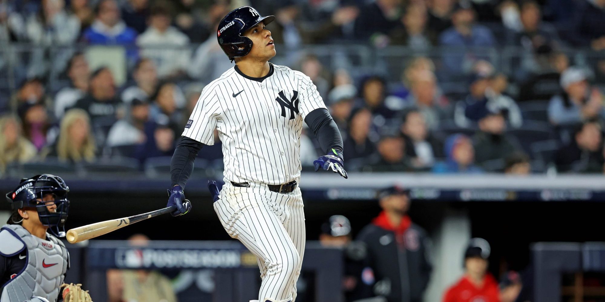 Oct 14, 2024; Bronx, New York, USA; New York Yankees outfielder Juan Soto (22) hits a solo home run during the third inning against the Cleveland Guardians in game one of the ALCS for the 2024 MLB Playoffs at Yankee Stadium.