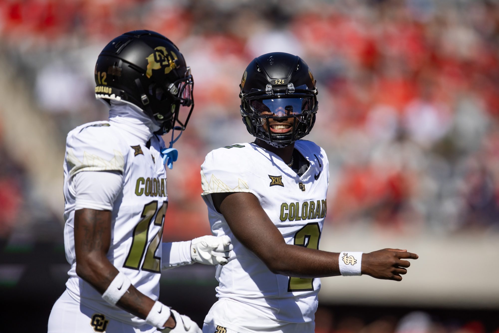 Oct 19, 2024; Tucson, Arizona, USA; Colorado Buffalos quarterback Shedeur Sanders (2) with wide receiver Travis Hunter (12) against the Arizona Wildcats at Arizona Stadium.