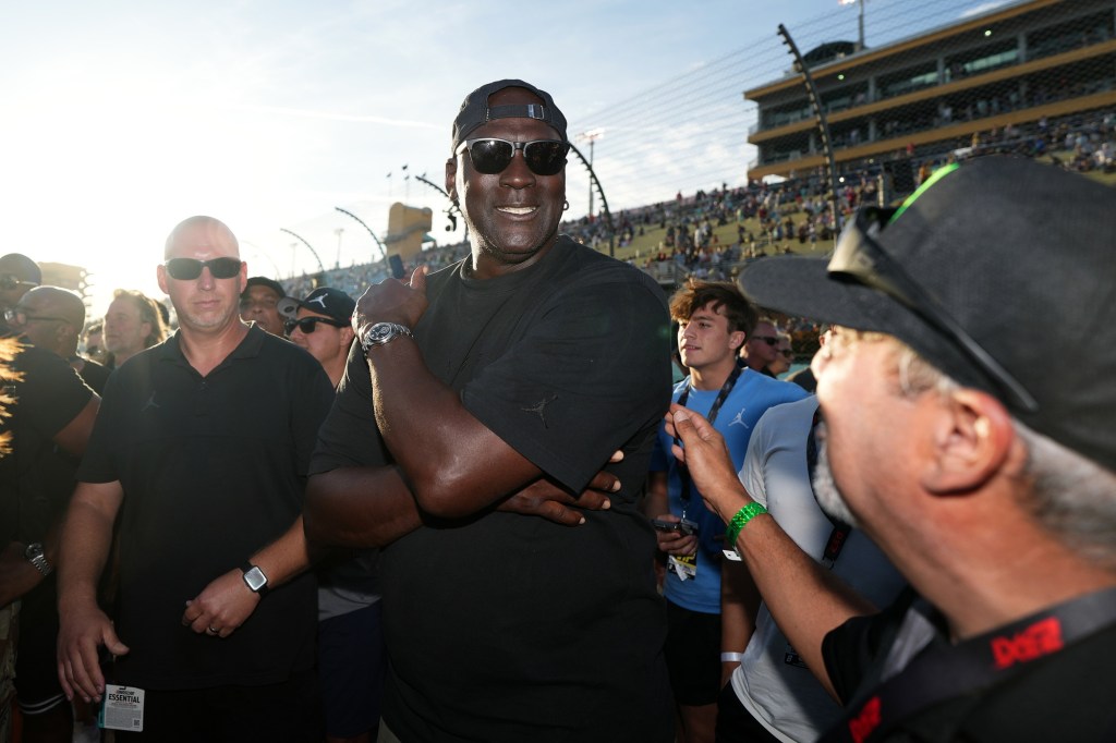 Oct 27, 2024; Homestead, Florida, USA; 23XI owner Michael Jordan celebrates after his driver NASCAR Cup Series driver Tyler Reddick (not pictured) won the Straight Talk Wireless 400 at Homestead-Miami Speedway.