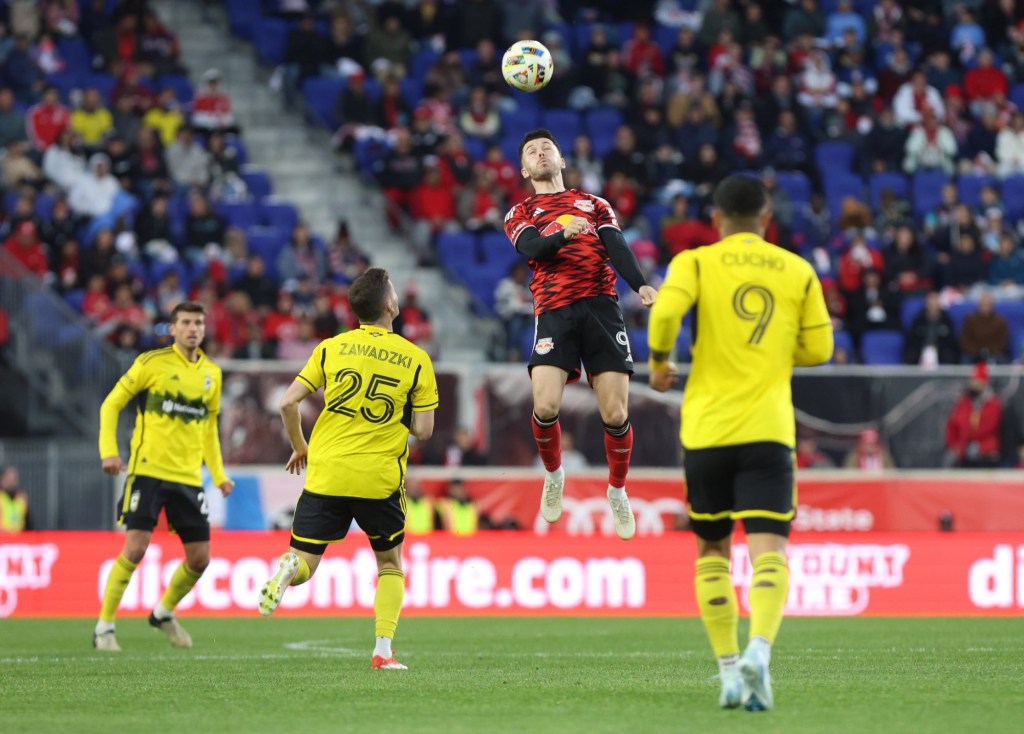 Nov 3, 2024; Harrison, New Jersey, USA; New York Red Bulls midfielder Lewis Morgan (9) heads a ball during the first half against the Columbus Crew in a 2024 MLS Cup Playoffs Round One match at Red Bull Arena.