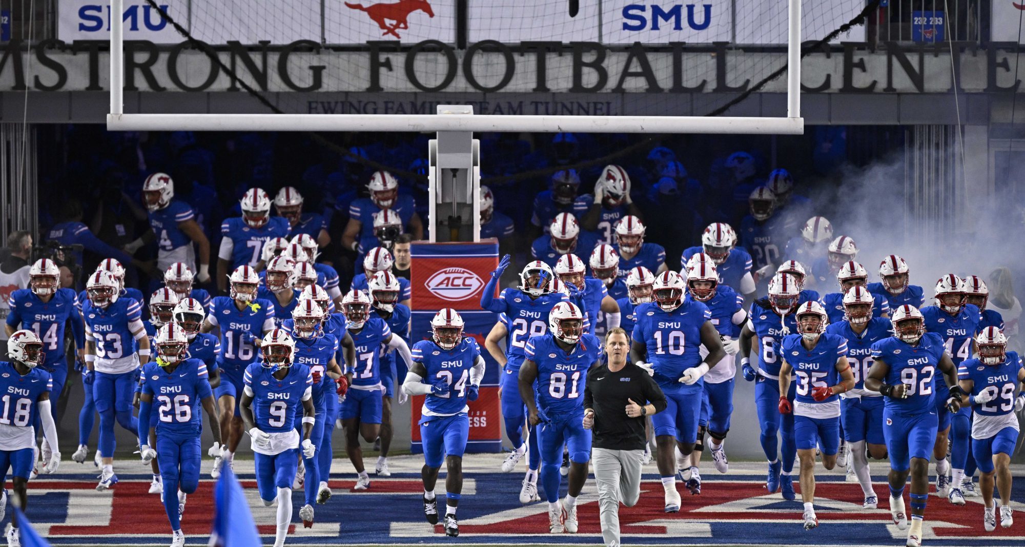 Nov 2, 2024; Dallas, Texas, USA; Southern Methodist Mustangs head coach Rhett Lashlee leads SMU on to the field before the game between the Southern Methodist Mustangs and the Pittsburgh Panthers at Gerald J. Ford Stadium.