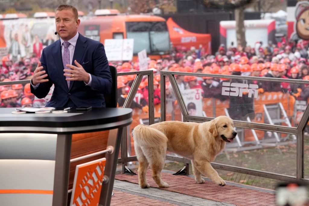 Kirk Herbstreit broadcasts from the ESPN College GameDay set with his dog, Peter, prior to the NCAA football game between the Ohio State Buckeyes and the Indiana Hoosiers at Ohio Stadium in Columbus on Saturday, Nov. 23, 2024.