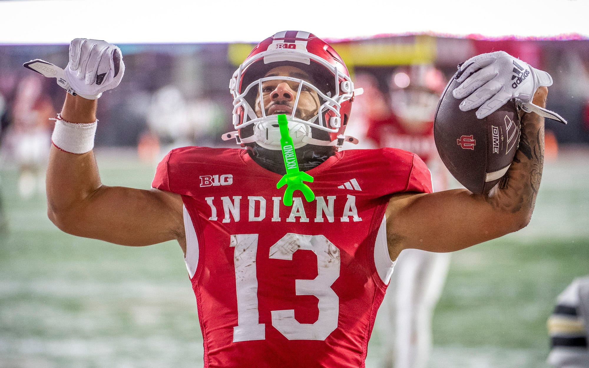 Indiana's Elijah Sarratt (13) celebrates a touchdown during the Indiana versus Purdue football game at Memorial Stadium on Saturday, Nov. 30, 2024.