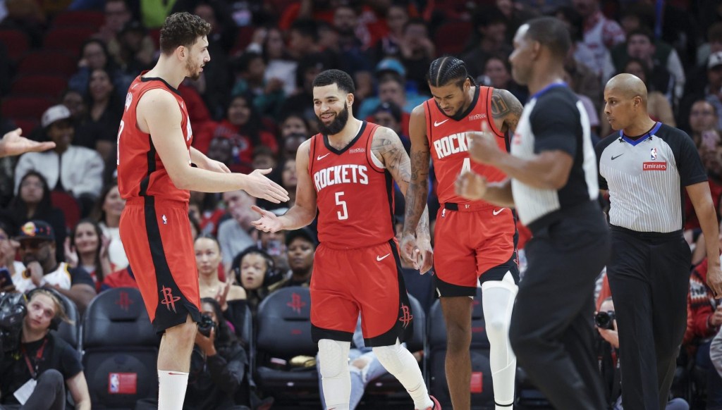 Dec 1, 2024; Houston, Texas, USA; Houston Rockets guard Fred VanVleet (5) celebrates with center Alperen Sengun (28) after scoring during the second quarter against the Oklahoma City Thunder at Toyota Center.