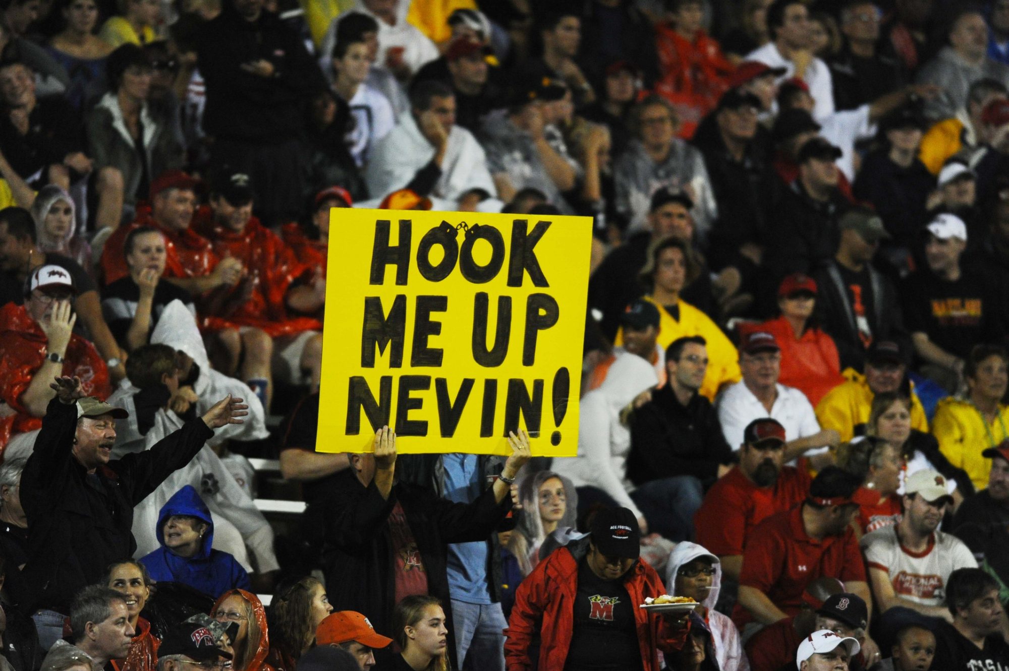 Sept 5, 2011; College Park, MD, USA; Maryland Terrapins fans hold up a sign referencing Miami Hurricanes former booster Nevin Shapiro during the first half at Capital One Field at Byrd Stadium.