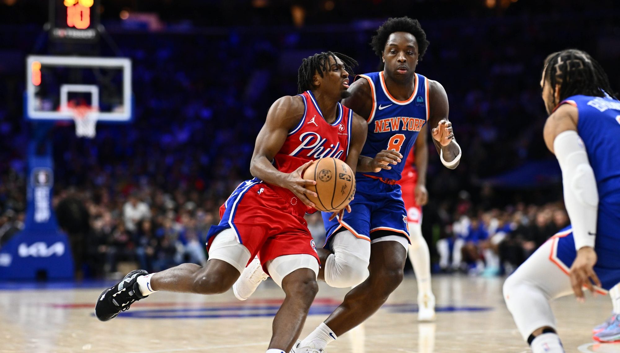 Jan 5, 2024; Philadelphia, Pennsylvania, USA; Philadelphia 76ers guard Tyrese Maxey (0) drives against New York Knicks forward OG Anunoby (8) in the fourth quarter at Wells Fargo Center.