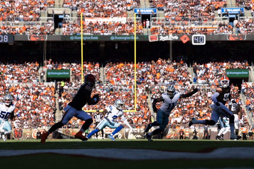 Sep 8, 2024; Cleveland, Ohio, USA; Cleveland Browns quarterback Deshaun Watson (4) runs the ball while looking for a receiver against the Dallas Cowboys during the first quarter at Huntington Bank Field.