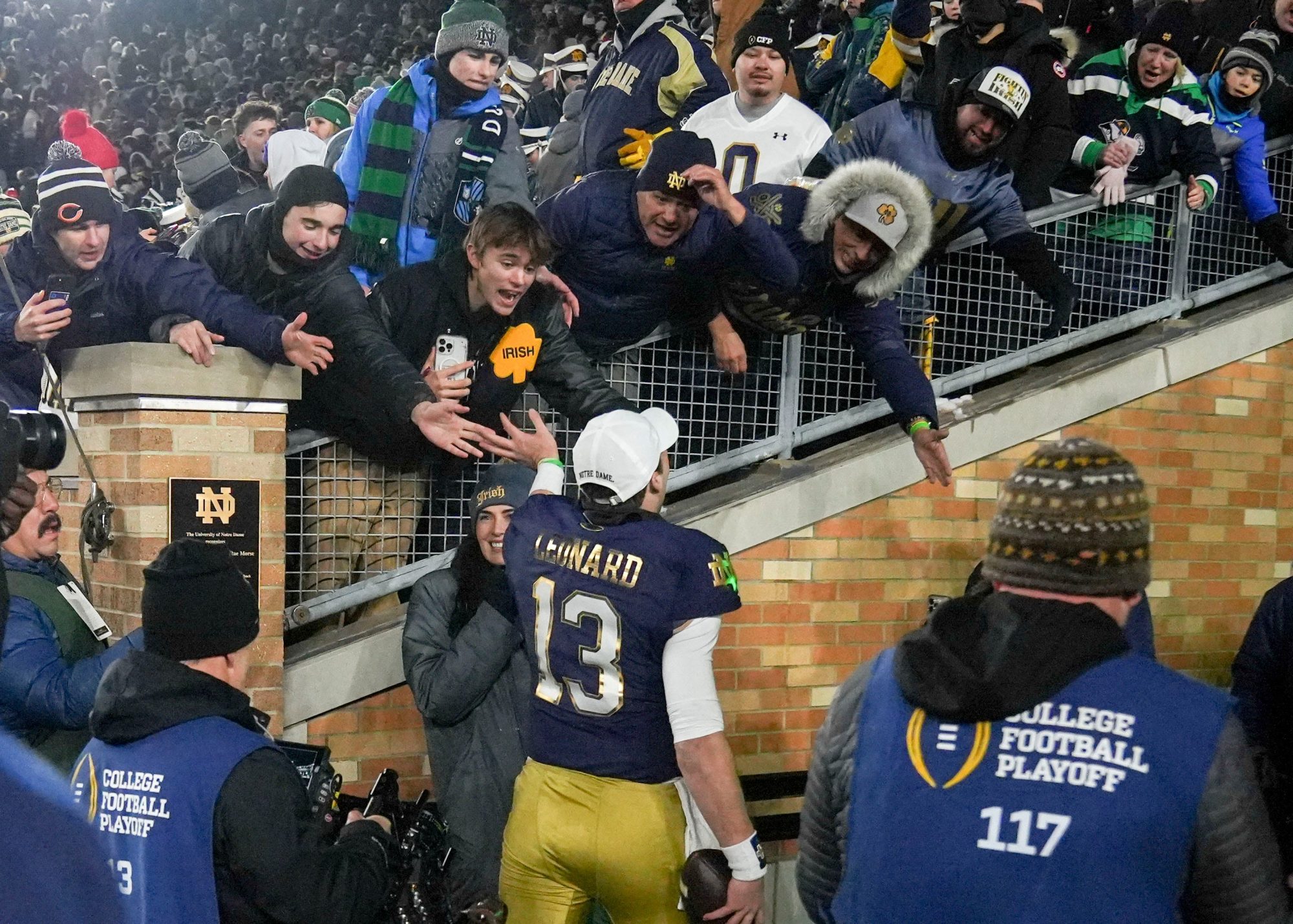 Notre Dame Fighting Irish quarterback Riley Leonard (13) celebrates with fans after winning a game between the Indiana Hoosiers and the Notre Dame Fighting Irish in first round of the College Football Playoff on Saturday, Dec. 21, 2024, in South Bend. Notre Dame defeated Indiana 27-17.