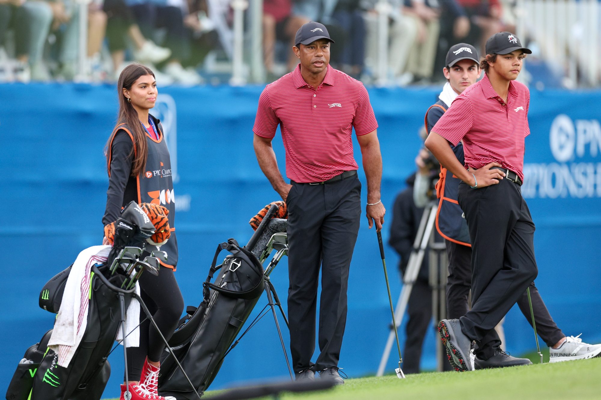 Dec 22, 2024; Orlando, Florida, [USA]; Tiger Woods son Charlie Woods and daughter Sam Woods look on during the PNC Championship at The Ritz-Carlton Golf Club.