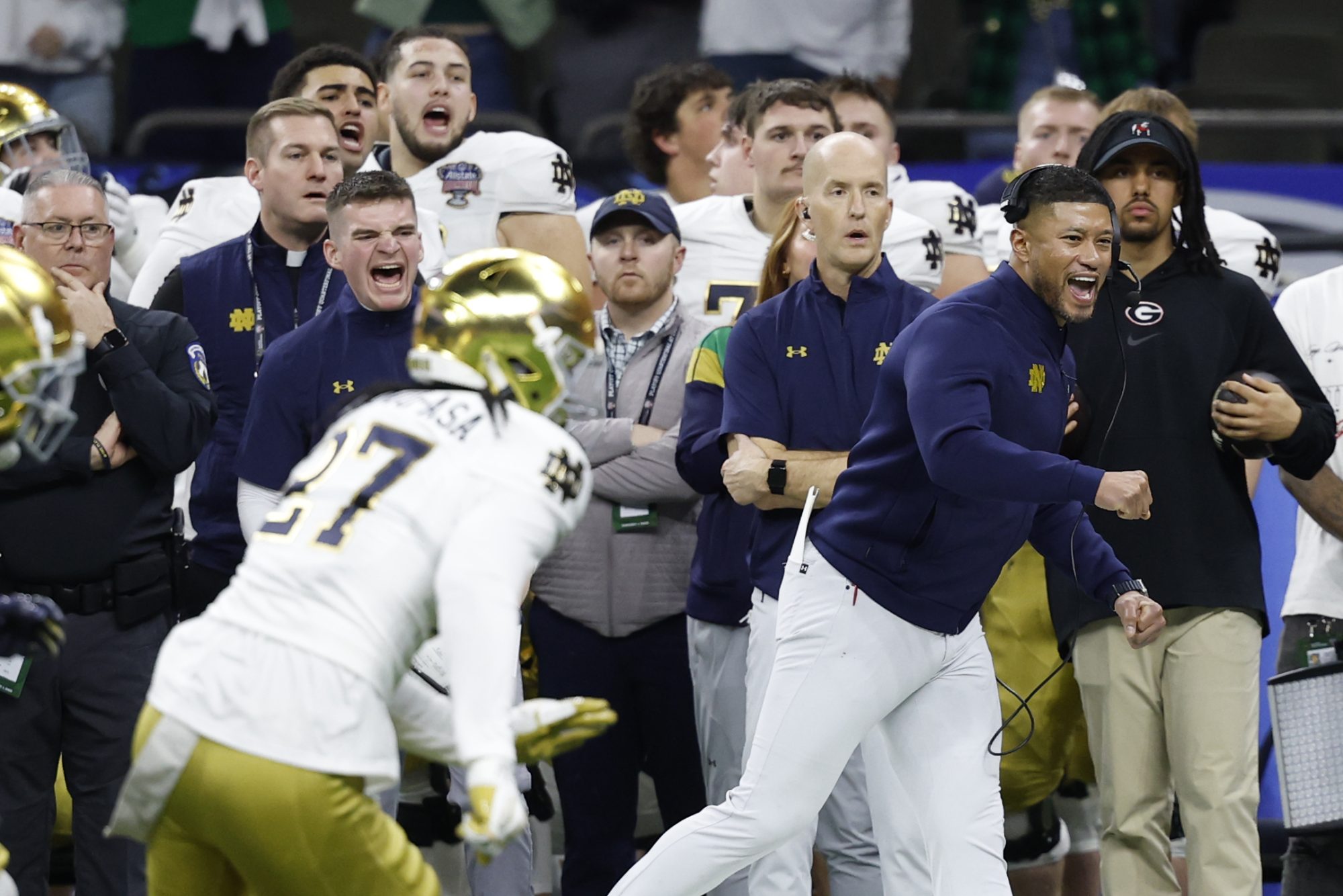 Jan 2, 2025; New Orleans, LA, USA; Notre Dame Fighting Irish head coach Marcus Freeman (R) reacts on the sidelines in the final minute against the Georgia Bulldogs during the fourth quarter at Caesars Superdome.