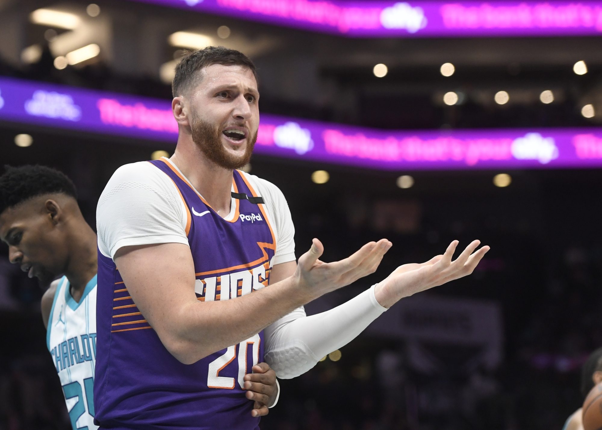 Jan 7, 2025; Charlotte, North Carolina, USA; Phoenix Suns center Jusuf Nurkic (20) reacts after being called on a foul during the second half against the Charlotte Hornets at the Spectrum Center.