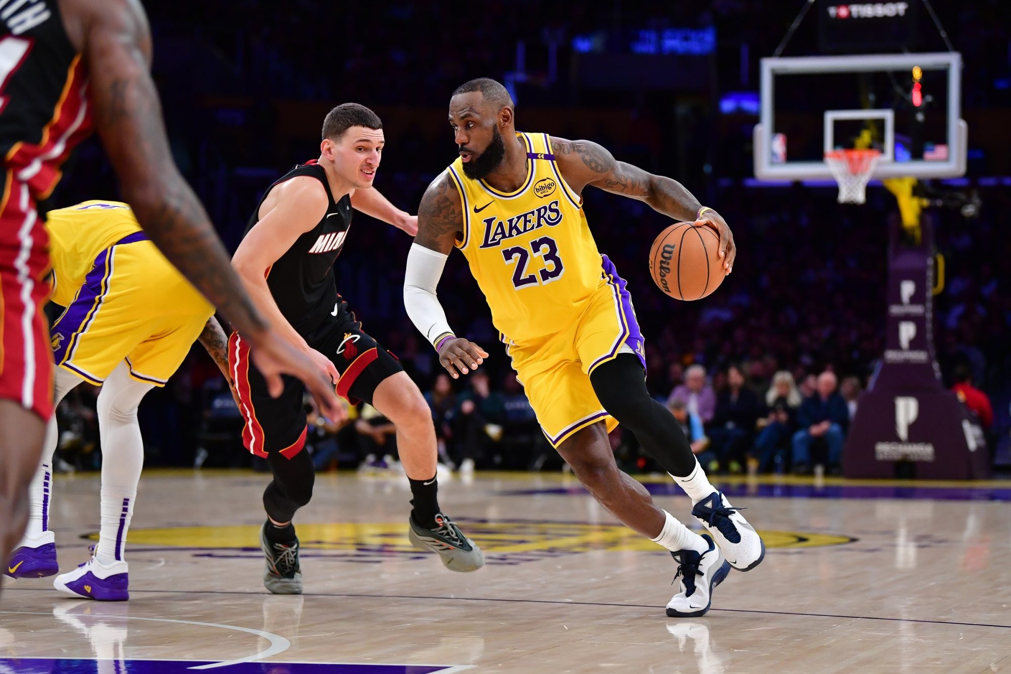 January 15, 2025; Los Angeles, California, USA; Los Angeles Lakers forward LeBron James (23) moves the ball against Miami Heat guard Tyler Herro (14) during the second half at Crypto.com Arena.