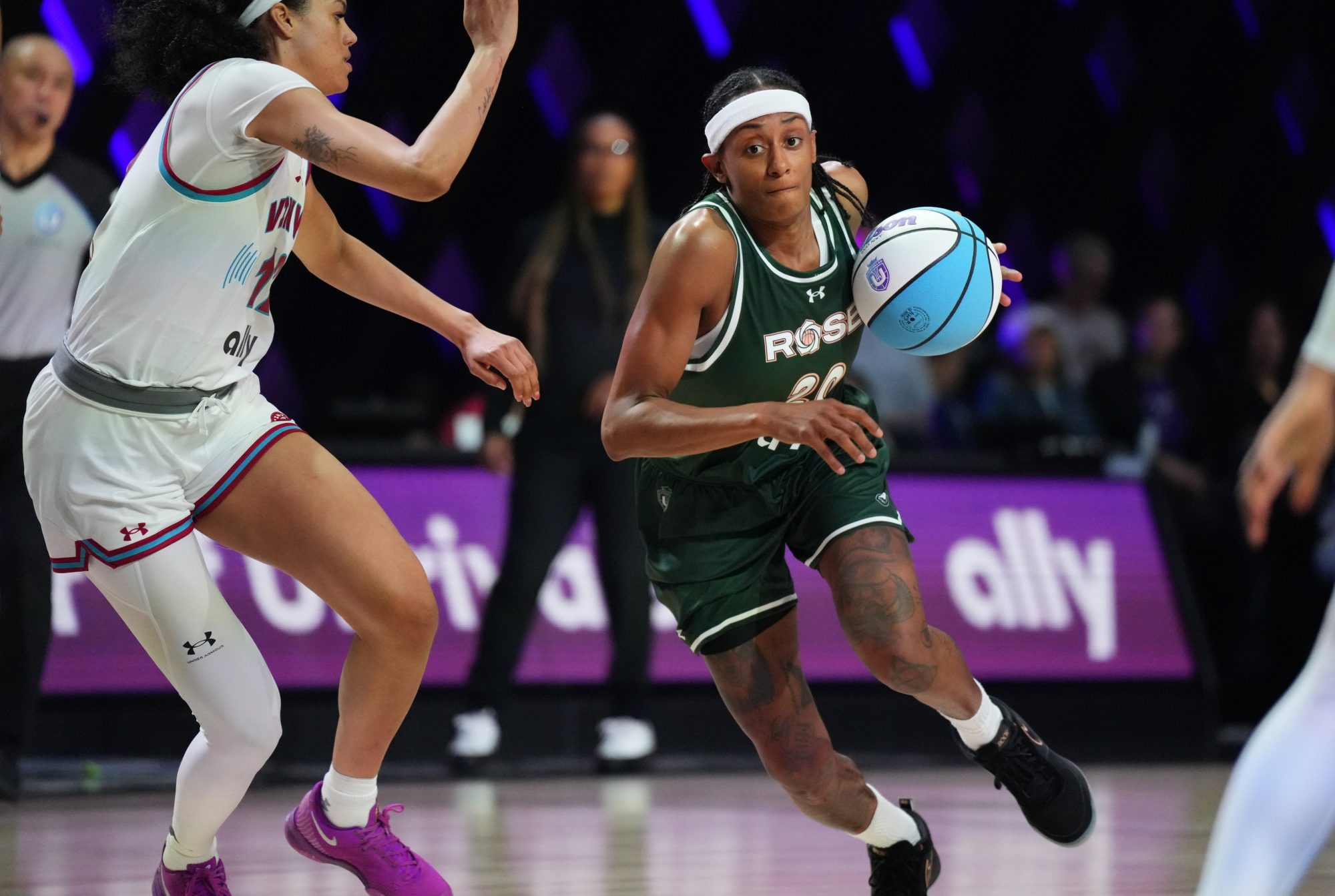 Jan 17, 2025; Miami, FL, USA; Brittney Sykes (20) of the Rose drives to the basket against Rae Burrell (12) of the Vinyl during the first half of the Unrivaled women’s professional 3v3 basketball league at Wayfair Arena.