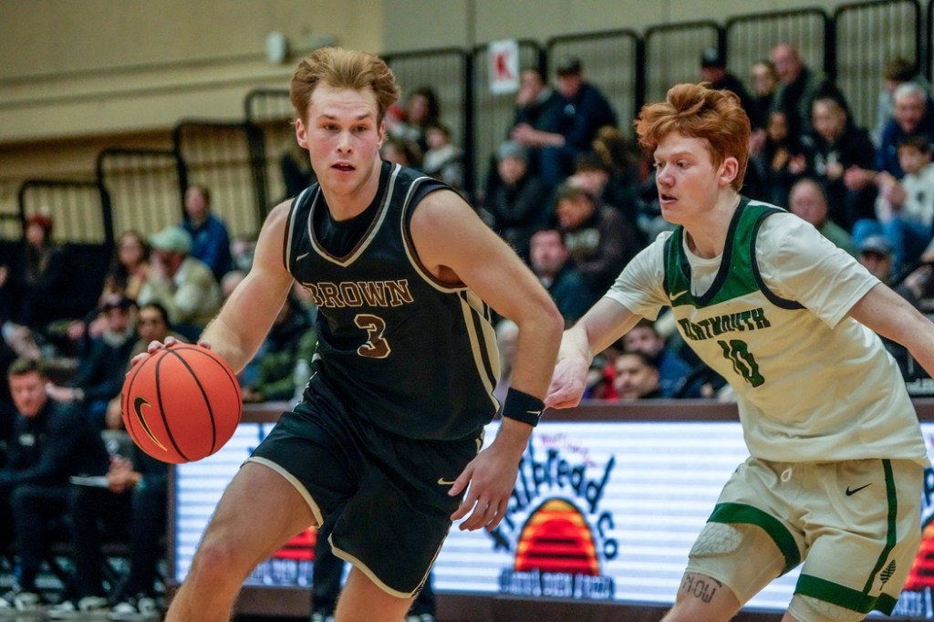 Brown falls to Dartmouth 84-83 at Pizzitola Sports Center. Alexander Lesburt Jr drives to the net with Ryan Cornish defending for Dartmouth.