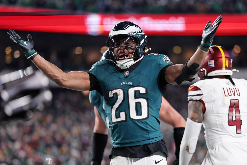 Jan 26, 2025; Philadelphia, PA, USA; Philadelphia Eagles running back Saquon Barkley (26) celebrates after a touchdown against the Washington Commanders during the second half in the NFC Championship game at Lincoln Financial Field.