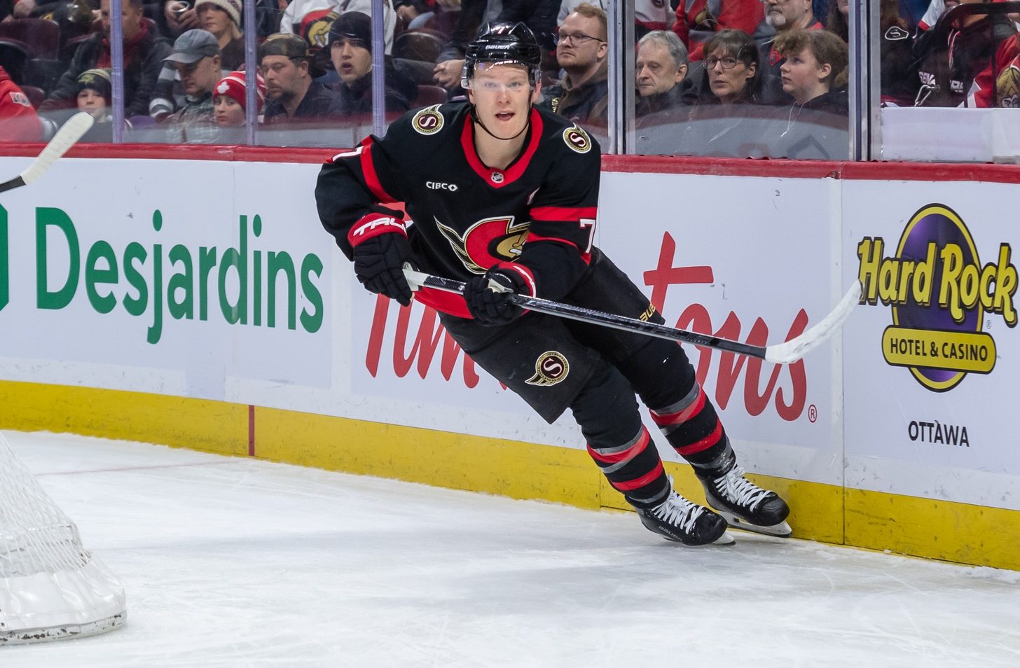 Jan 26, 2025; Ottawa, Ontario, CAN; Ottawa Senators left wing Brady Tkachuk (7) moves the puck in the second period against Utah in their game at the Canadian Tire Centre.