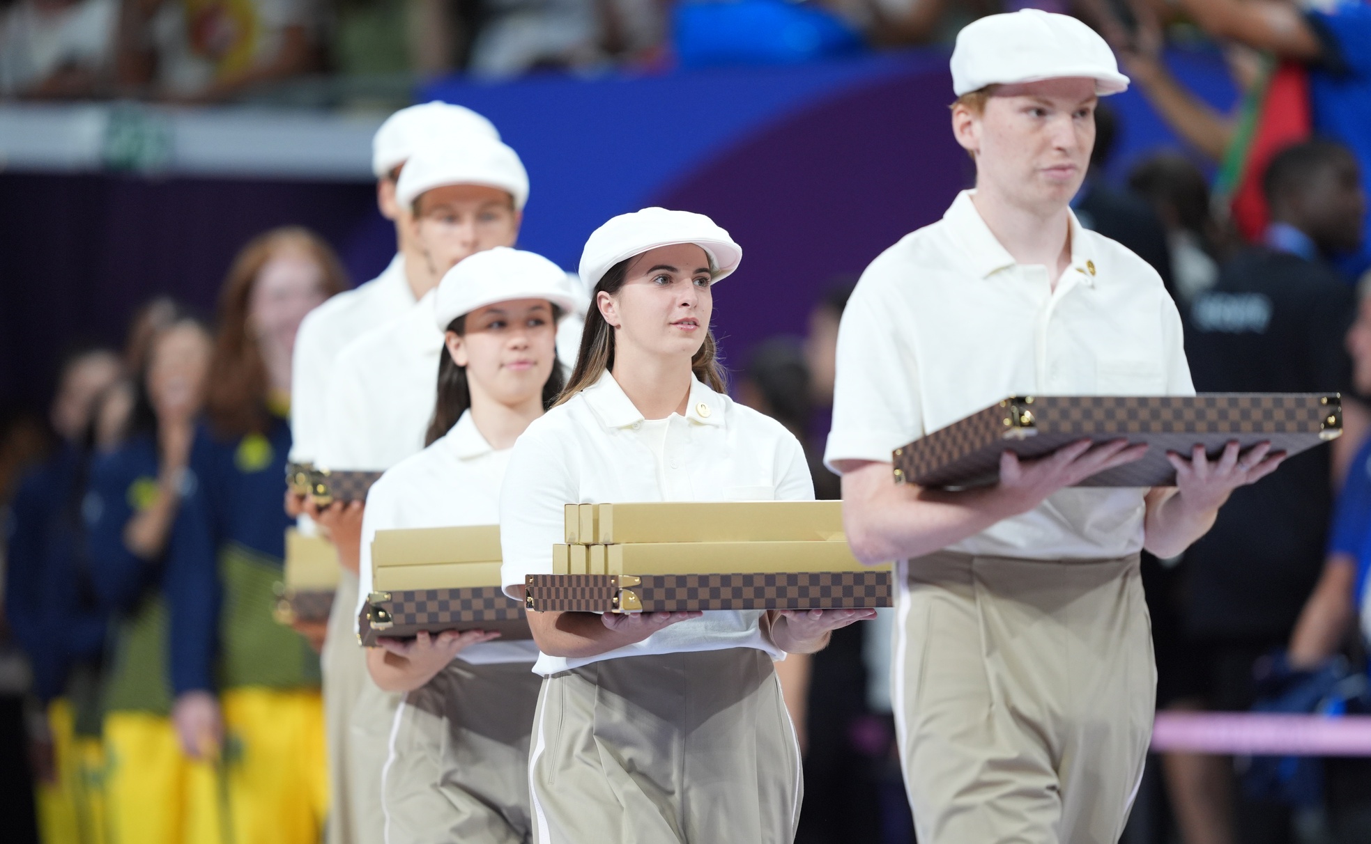 Aug 11, 2024; Paris, France; Medals are carried out on Louis Vuitton trays after the women's volleyball gold medal match during the Paris 2024 Olympic Summer Games at South Paris Arena