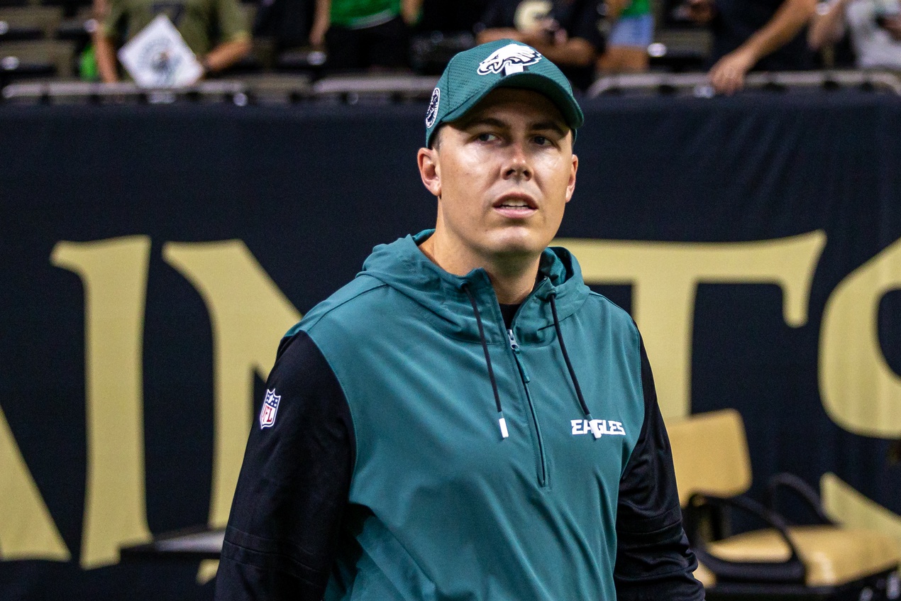 Sep 22, 2024; New Orleans, Louisiana, USA; Philadelphia Eagles offensive coordinator Kellen Moore looks on during warmups before the game against the New Orleans Saints at Caesars Superdome.