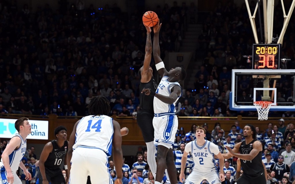 Dec 31, 2024; Durham, North Carolina, USA; Virginia Tech Hokies forward Tobi Lawal (1) and Duke Blue Devils center Khaman Maluach (9) battle for the opening tip during the first half at Cameron Indoor Stadium.