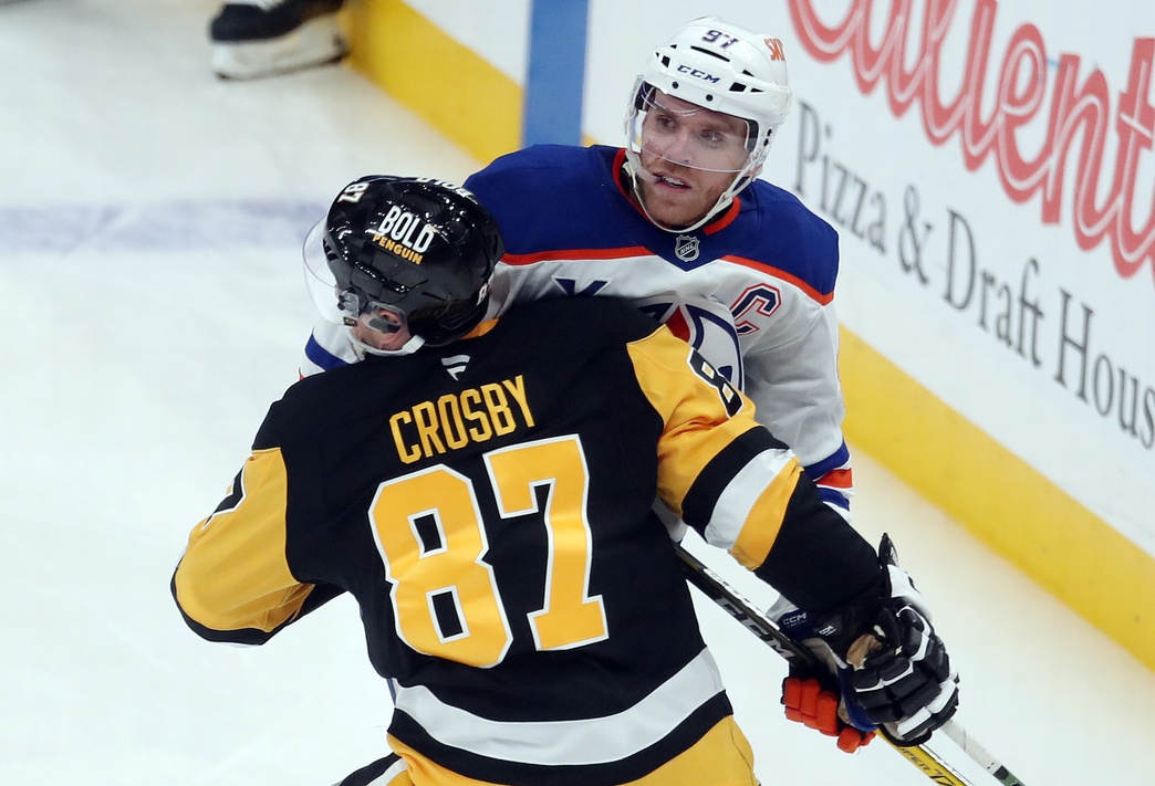 Jan 9, 2025; Pittsburgh, Pennsylvania, USA; Edmonton Oilers center Connor McDavid (97) checks Pittsburgh Penguins center Sidney Crosby (87) during the third period at PPG Paints Arena